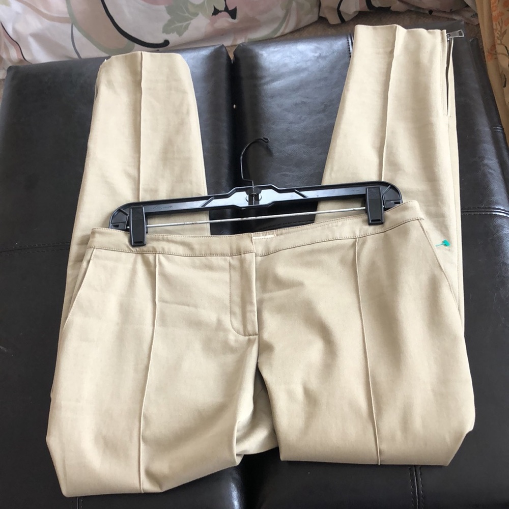 Burberry khaki pants with zippers on side.